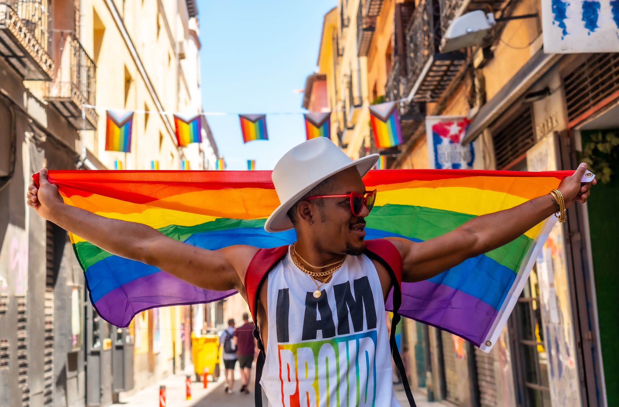 a-gay-black-man-walking-at-the-pride-party-with-an-2023-11-27-05-33-58-utc